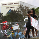 Tyra Heman (right), a senior at Marjory Stoneman Douglas High School, is hugged on Feb. 19, 2018, by Rachael Buto in front of the school, where 17 people were killed on Feb. 14, 2018, in Parkland, Fla.
